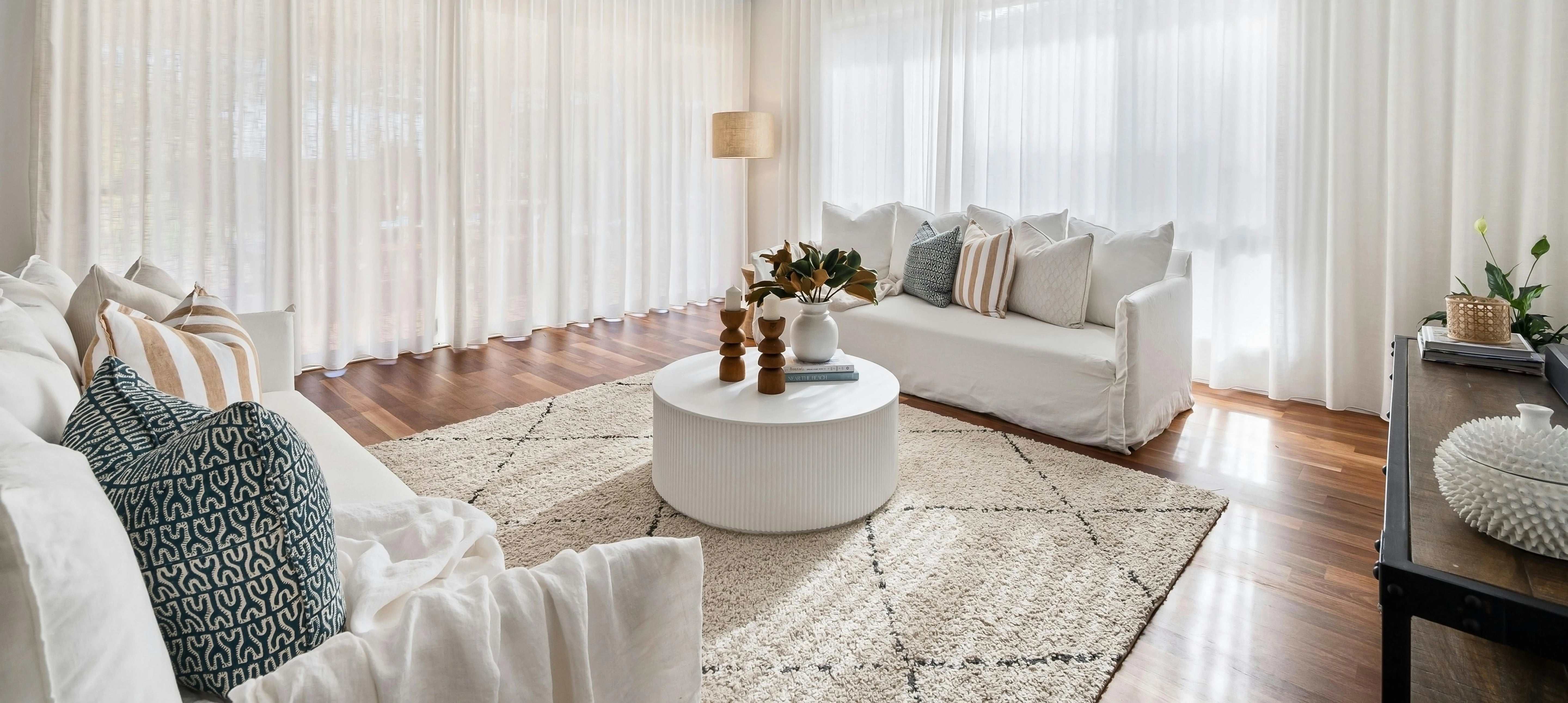 Elegant pinch pleated curtains adding sophistication to a cozy living room