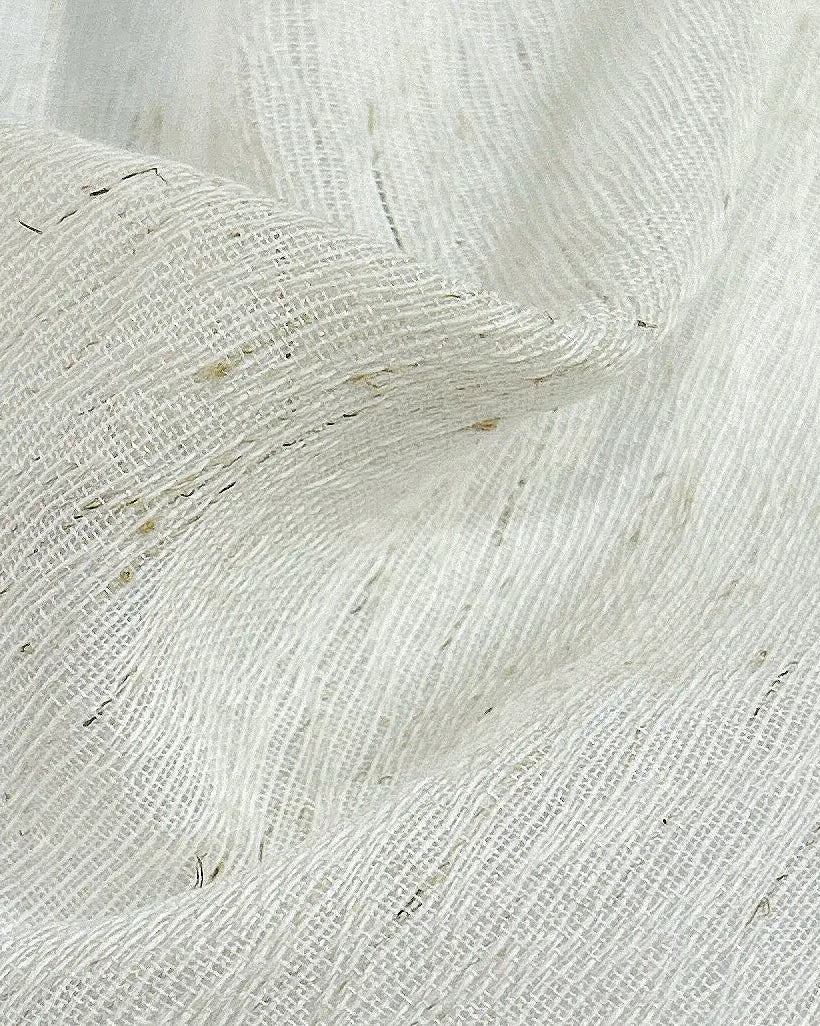 Close-up of sheer fabric sample with a textured weave, perfect for light, airy curtain designs or upholstery.