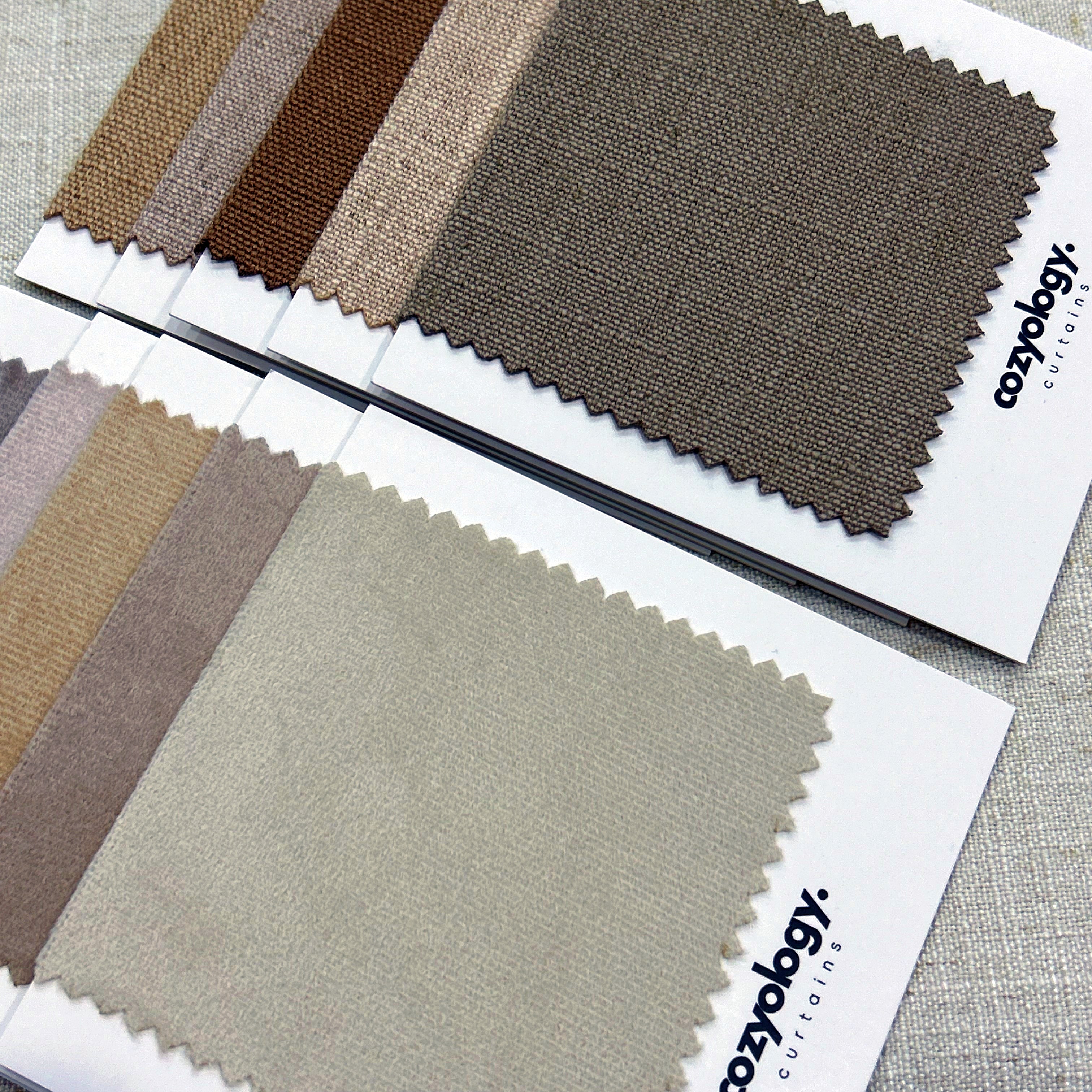 Fabric samples in earthy color tones from Cozyology, offering a variety of neutral shades for curtains and upholstery.